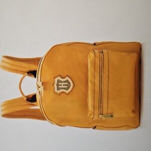 J.W.HULME CREST HERITAGE  Pebble Grain Backpack In Mustard Color